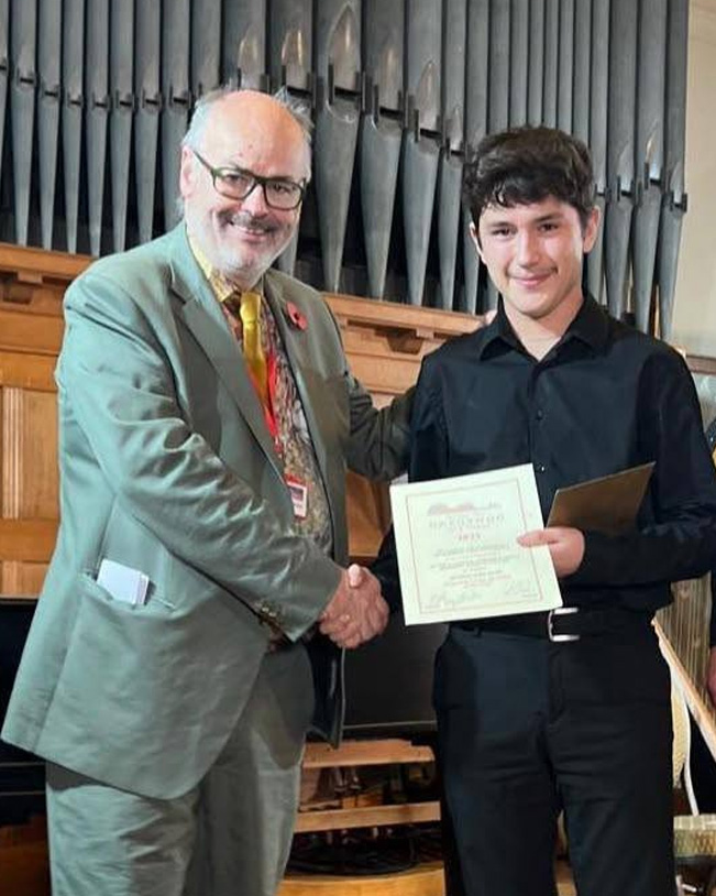 Gareth Jenkins with young musicians at the Gregynog Young Musician Competition